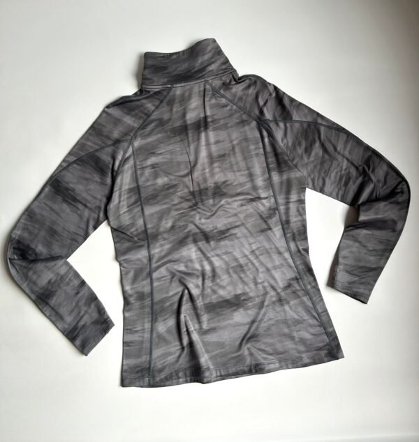 WhatsApp Image 2026-02-20 at 14.41.13 (1) Remera Under Armour Térmica Gris 1/4 Zip