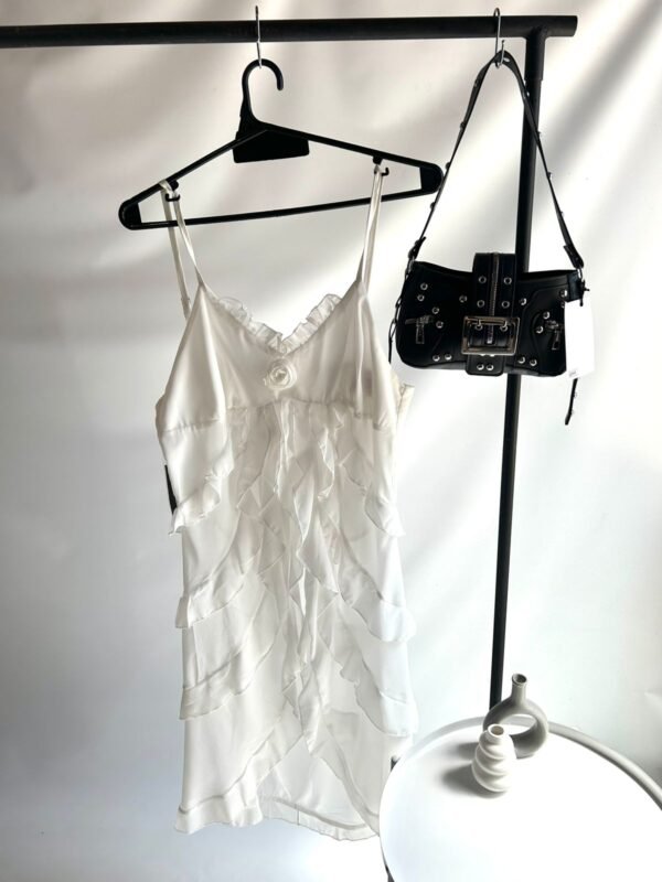 WhatsApp Image 2026-02-23 at 14.36.05 (4) Top Negro con Volados y Corte Asimétrico