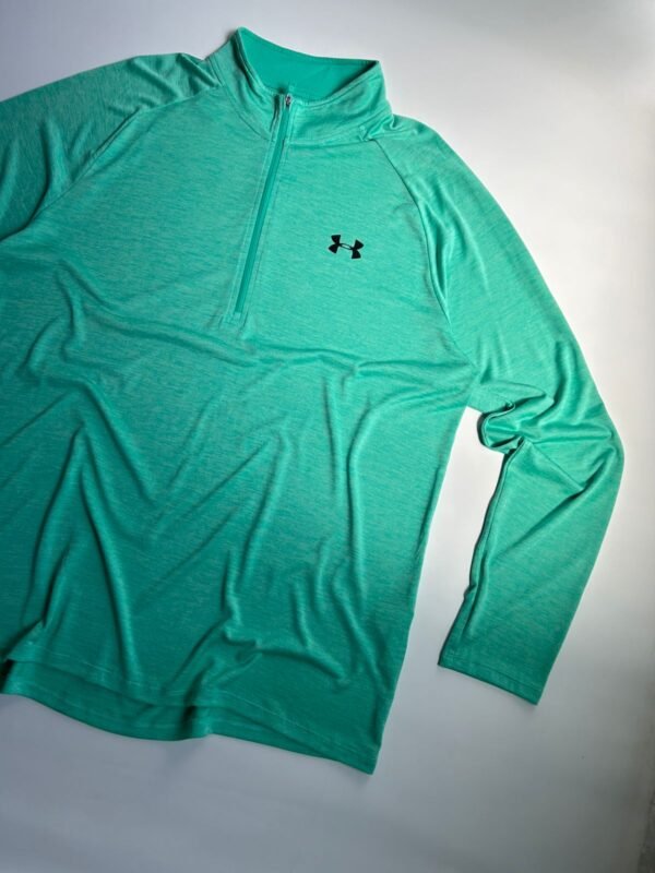 WhatsApp Image 2026-02-23 at 18.30.10 (1) Remera Under Armour Verde1/4 Zip